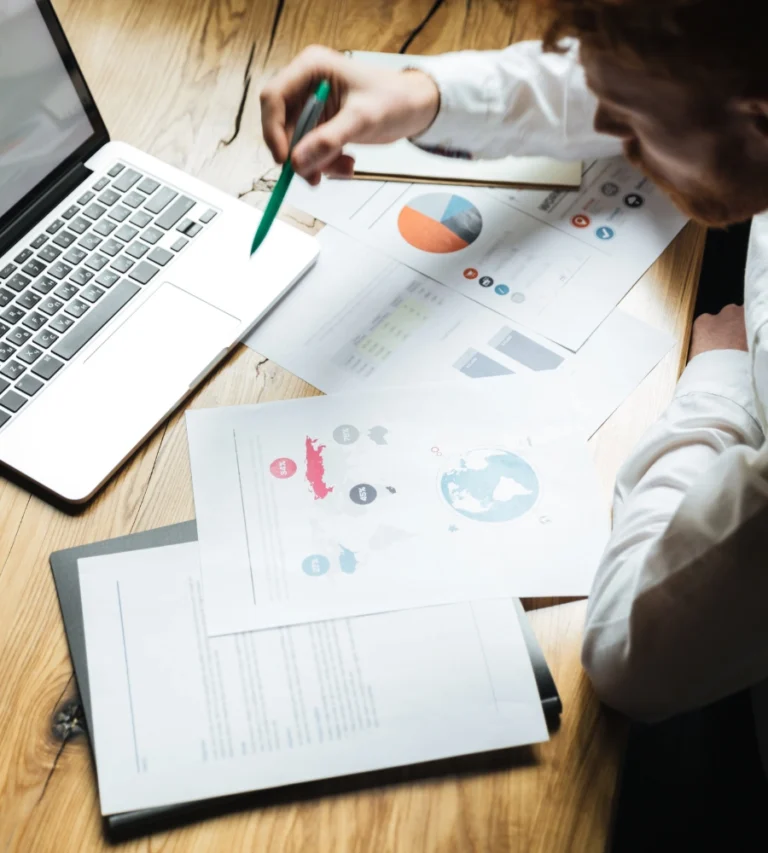 Procurement professional reviewing supplier data and sourcing reports